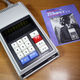 Sharp’s QT-8B Micro Compet from 1970, the first battery-powered pocket calculator, pictured here in its charging dock.